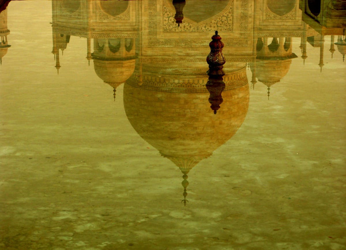 Taj Mahal at sunrise — the marble glowing pink in early morning light